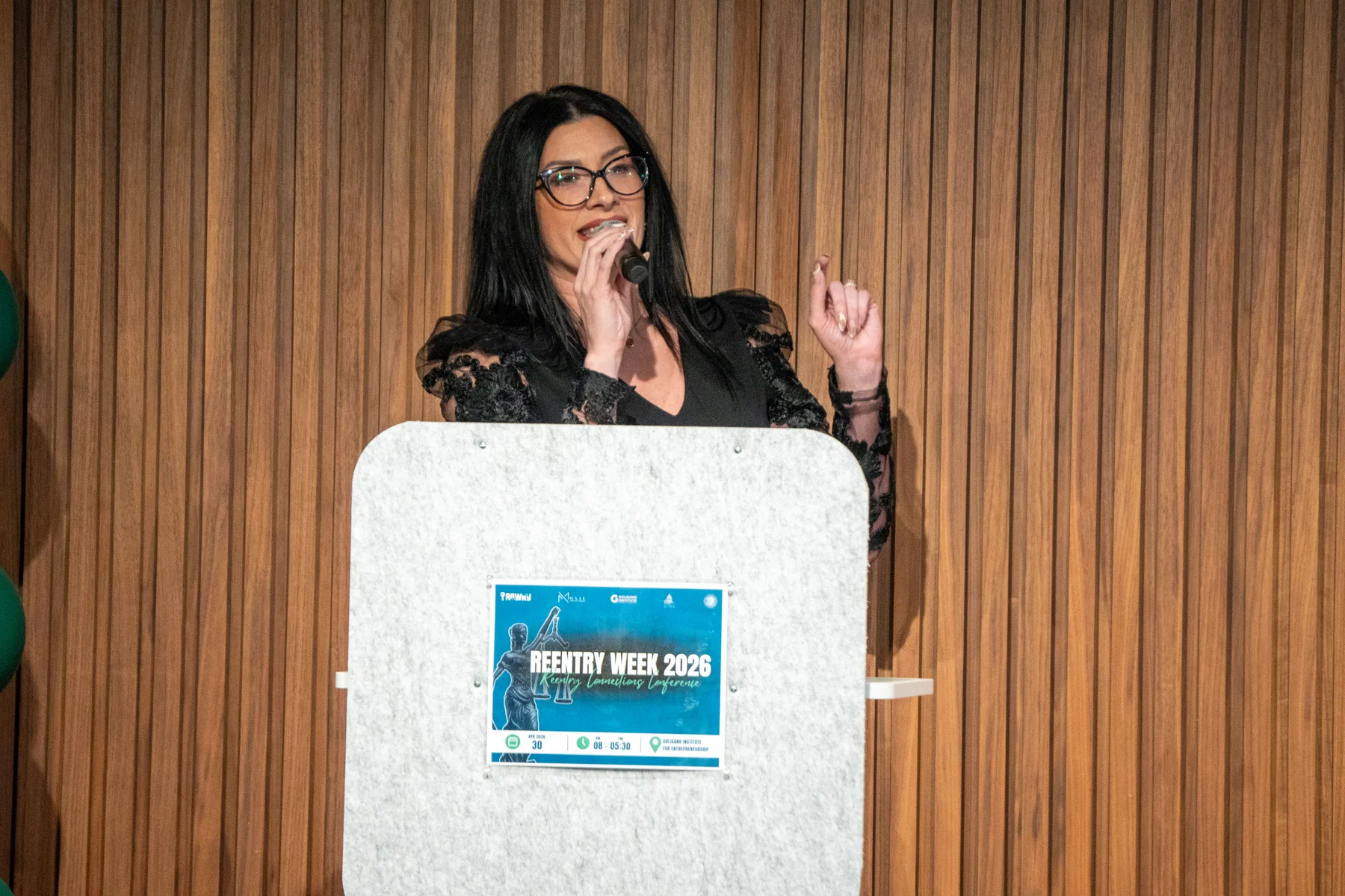 Speaker presenting from the RAWNY Reentry Week podium