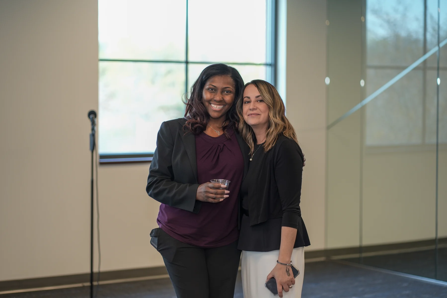 Two guests posing together at the RAWNY Reentry Connections Conference