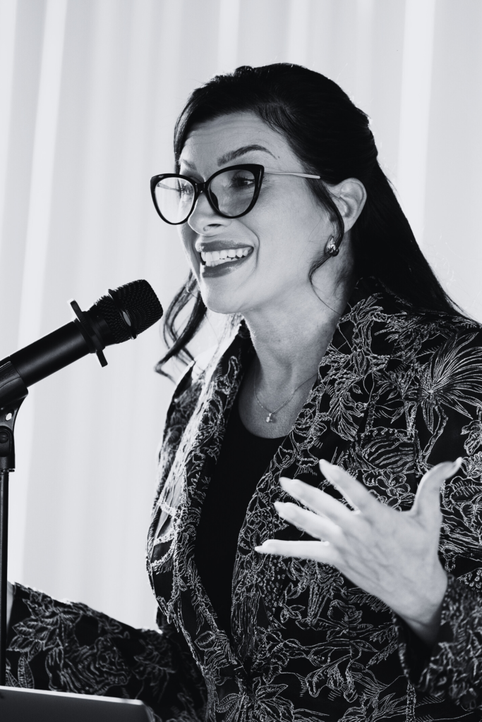 Stephanie Armstrong speaking at a microphone